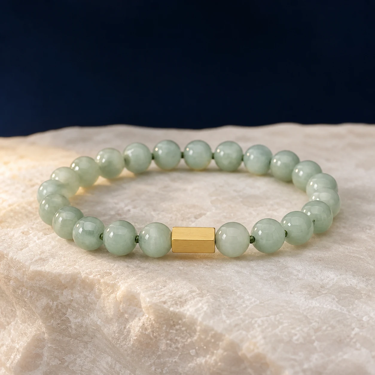 Green jade bracelet with natural tonal variation